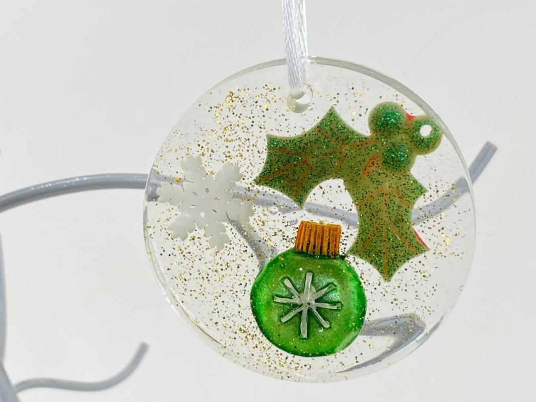 Round Christmas Ornament with snowflake, holly and sparkle