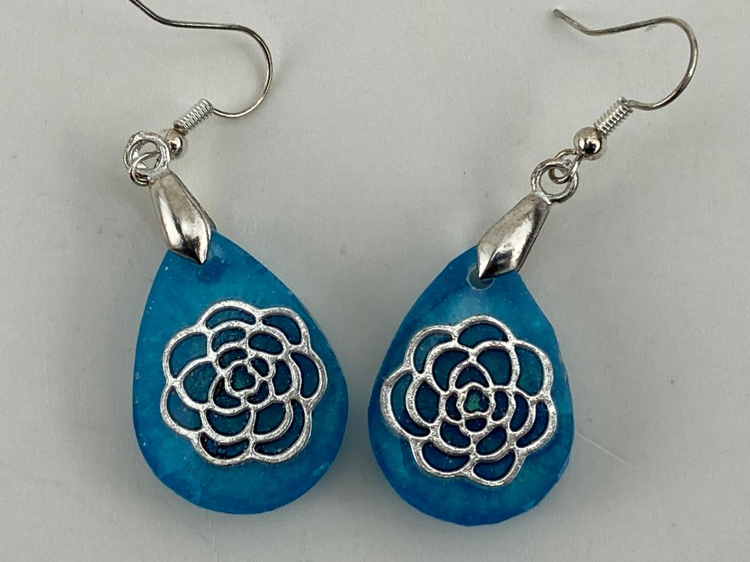 Rose outline in blue epoxy resin earrings